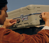 Desert sand hardshell check-in suitcase with leather handles and TSA lock for international travel