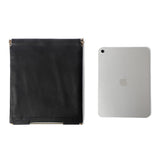 The Nappa Dori black Muse Clutch Bag Large shown with an iPad, demonstrating its spacious interior perfect for tech essentials.