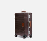 Designer brown Wingman hardshell travel suitcase with extended handle, 4-spinner wheels & luxury leather accents angled