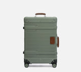 Premium hardshell luggage with tan leather patches, 4-wheel spinner system in warm ambient light travel photography