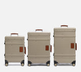 Wingman Luggage set of 3 in desert sand lightweight cabin and check-in suitcases with vintage leather handles.
