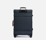 Back view of the durable Midnight Blue travel suitcase, designed to withstand the rigors of checked baggage handling