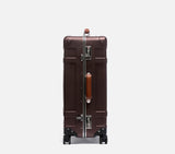 Wingman brown hardshell rolling luggage side profile showing sleek depth, spinner wheel system & vintage-style durability