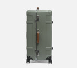 Side view of a wingman green trunk suitcase with TSA lock. This durable luggage is a premium choice for travel suitcases