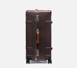 Side profile of a wingman luxury suitcase with TSA locks. This vintage-style hard shell luggage ensures secure, stylish travel.