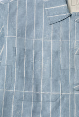 Close-up of a blue pinstripe shirt with a pocket
