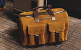 Hitchhiker Suede Duffle Bag in tan with vintage pockets, a premium leather travel duffel bag for weekend getaways.