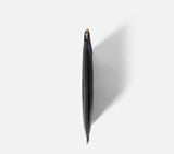 Side view of the black Muse Clutch Bag for women Large, displaying its slim silhouette and expandable gusset for extra storage space.