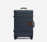 Front view of the Midnight Blue Wingman check-in suitcase, a durable hardshell option ideal for long-haul international travel.