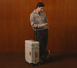 Front view of the Midnight Blue Wingman check-in suitcase, a durable hardshell option ideal for long-haul international travel.